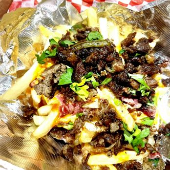 Sarah's Triple S - Loaded fries with Steak or Pastrami topped with Beer cheese sauce and hot sauce. - Food Trucks Near Me Sarah's Triple S - Loaded fries with Steak or Pastrami topped with Beer cheese sauce and hot sauce. - Food Trucks Near Me