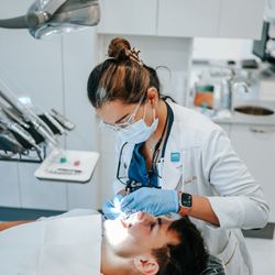 Smiles On Enterprise - Doctor working with a patient