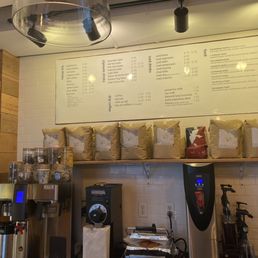 a menu and coffee machines a menu and coffee machines