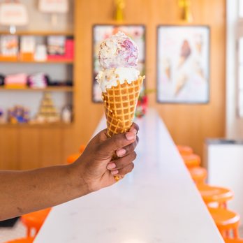 Jeni's Splendid Ice Creams - a hand holding an ice cream cone - Ice Cream & Frozen Yogurt Near Me - Chicago, Illinois Jeni's Splendid Ice Creams - a hand holding an ice cream cone - Ice Cream & Frozen Yogurt Near Me - Chicago, Illinois