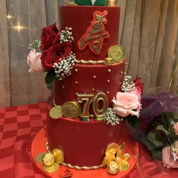 E's Cake Shop - Three tier cake with a fake bottom tier and the top two tiers was a mango and strawberry flavor - Custom Cakes Near Me - Brooklyn, New York E's Cake Shop - Three tier cake with a fake bottom tier and the top two tiers was a mango and strawberry flavor - Custom Cakes Near Me - Brooklyn, New York