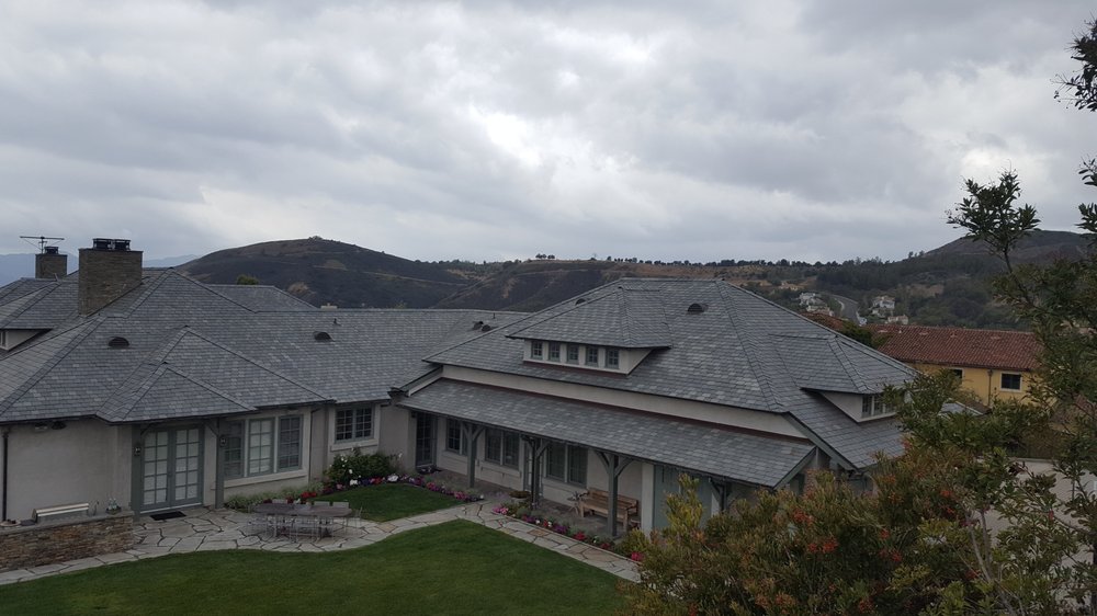 Slide of CJ West Roofing