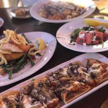 Garré Cafe - duck mushroom flatbread, salmon and the seafood rigatoni in the back - Mediterranean Near Me - Livermore, California Garré Cafe - duck mushroom flatbread, salmon and the seafood rigatoni in the back - Mediterranean Near Me - Livermore, California