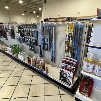 Lupton Truck Stop - A store aisle displays automotive accessories, including windshield wipers, fluids, and other car maintenance products on metal shelves. - Service Stations Near Me - Lupton, Arizona