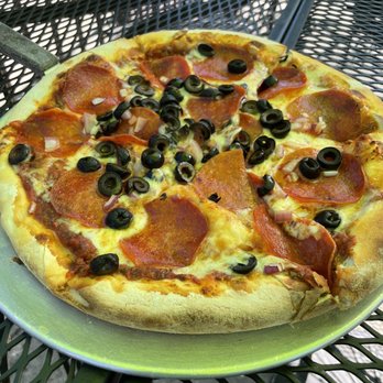 Capones Pub & Grill - Medium pizza with skimpy olives and onions. - American Near Me - Coeur D Alene, Idaho Capones Pub & Grill - Medium pizza with skimpy olives and onions. - American Near Me - Coeur D Alene, Idaho