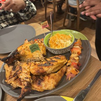 Elite Event: Nando's - Montrose - Lemon & herb chicken leg quarters, mango & lime chicken thigh skewers, mac & cheese - Yelp Events Near Me - Houston, Texas