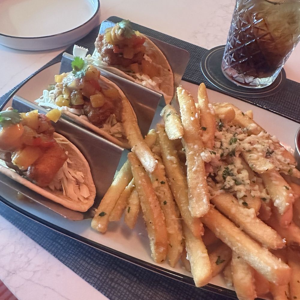 Cirque St. Armands Beachside - Ringside - Fried fish tacos with pineapple chutney, and a side of truffle fries. - Seafood Near Me - Sarasota, Florida Cirque St. Armands Beachside - Ringside - Fried fish tacos with pineapple chutney, and a side of truffle fries. - Seafood Near Me - Sarasota, Florida