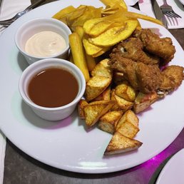 Sampler. Fries cheese, fish bites, chicken wings, sorullos, and plantain strips. Served with a delicious mayo ketchup, and guava sauce.