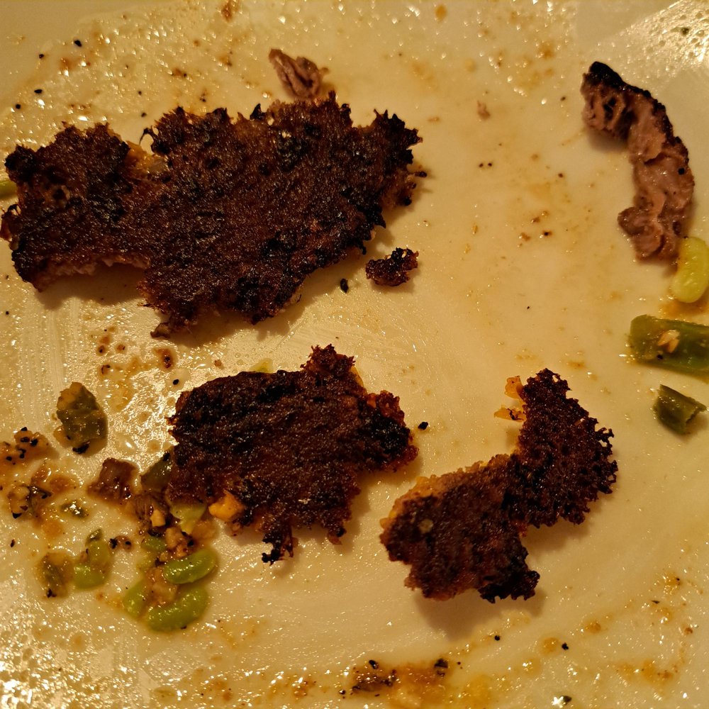 This is the burnt bottom of a cheese burger at applebees in Bangor, Maine. Worst meal we have had in some time.
