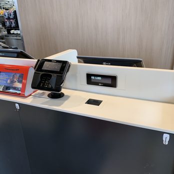 McDonald's - a counter with a phone and a picture of a man in the background - Fast Food Near Me - Berrien Springs, Michigan McDonald's - a counter with a phone and a picture of a man in the background - Fast Food Near Me - Berrien Springs, Michigan