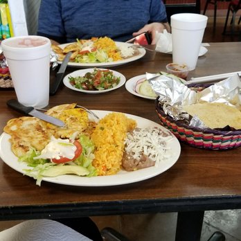 La Potosina Supermarket - man sitting at a table with plates of food - Mexican Near Me - Jonesboro, Georgia La Potosina Supermarket - man sitting at a table with plates of food - Mexican Near Me - Jonesboro, Georgia