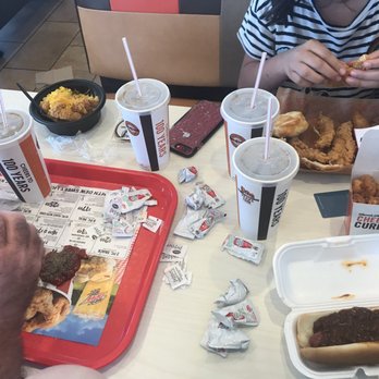 A&W Restaurant - a man and a woman eating food - Fast Food Near Me - Los Banos, California