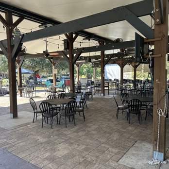 One Love Cafe - a patio with tables and chairs - Cafes Near Me - Gainesville, Florida One Love Cafe - a patio with tables and chairs - Cafes Near Me - Gainesville, Florida