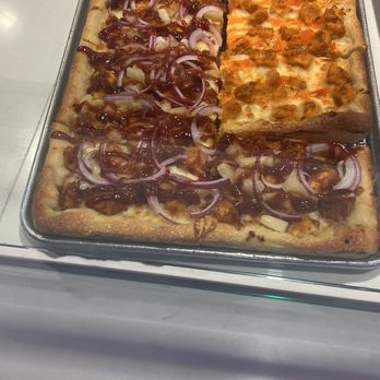 Carnegie Pizza - Sample of pizza's behind the countair - Pizza Near Me - Las Vegas, Nevada