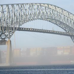 Fort Armistead Park - A boat traverses the Patapsco River en route to the Port of Baltimore under the I-695 Bridge.