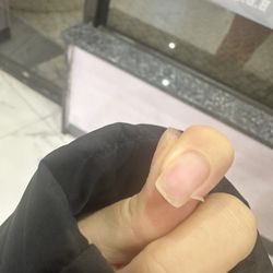 Livingston Nail Studio - Nails were ripping right after gel removal and nail has red fire marks from drilling all the way through.