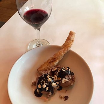 Chez Panisse - Chocolate hazelnut ice cream with toasted hazelnuts from oregon and chocolate sauce paired with Alice Water's Red Zinfandel - New American Near Me - Berkeley, California