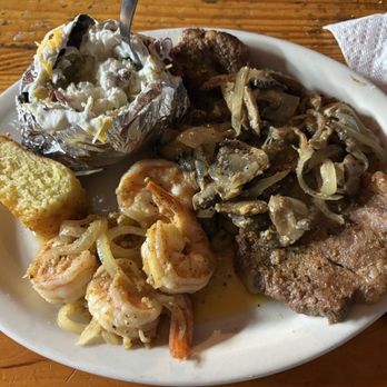 Circle Bar & Saddleback Steakhouse - New York Steak with loaded baked potato and shrimp - Steakhouses Near Me - Balmorhea, Texas Circle Bar & Saddleback Steakhouse - New York Steak with loaded baked potato and shrimp - Steakhouses Near Me - Balmorhea, Texas
