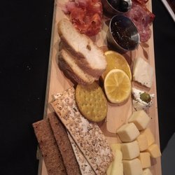 Berta’s Tapas & Bar - Cheese plate with various cheeses, olives, fig jam, cured meats.