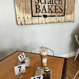 a table with pastries and a cup of coffee