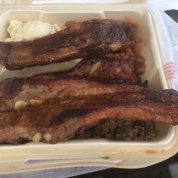 Ribs rice dressing and potato salad