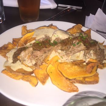 Roosevelt's - Amended fries, $11. Lamb, sweet potato fries and beer cheese sauce. - Gastropubs Near Me - Tulsa, Oklahoma