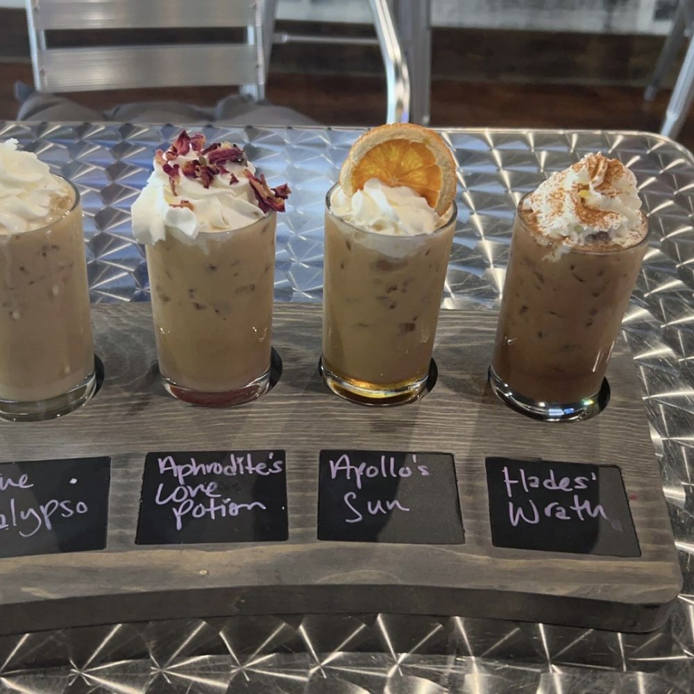 Calypso Coffee Bar - Coffee Flight with: The Calypso, Aphrodite's Love Potion, Apollo's Sun, and Hades' Wrath - Coffee & Tea Near Me - Apopka, Florida Calypso Coffee Bar - Coffee Flight with: The Calypso, Aphrodite's Love Potion, Apollo's Sun, and Hades' Wrath - Coffee & Tea Near Me - Apopka, Florida