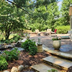 Narnia Landscaping Design and Construction - Converted three tier Patio to one level then updated with new stone