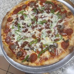 Amigo's Pizza - Pizza Sopranos.  Pepperoni sausage mushrooms onions green peppers bacon mozzarella cheese