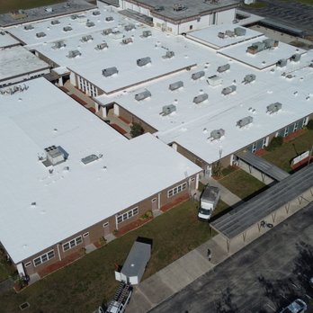 CES Roofing - SPF roofing project -Port Charlotte middle school, delivering seamless waterproofing, insulation, energy efficiency & long-term protection. - Roofing Near Me - Palm Harbor, Florida CES Roofing - SPF roofing project -Port Charlotte middle school, delivering seamless waterproofing, insulation, energy efficiency & long-term protection. - Roofing Near Me - Palm Harbor, Florida