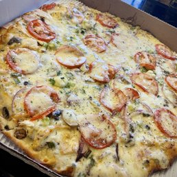 Village Garlic Chicken, thin crust with extra cheese. A very, very good pizza. Village Garlic Chicken, thin crust with extra cheese. A very, very good pizza.