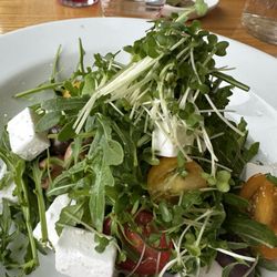 The Holly Tree Returant - Feta salad with one cherry tomato cut into tiny slices, three grapes and three olives.