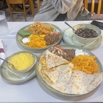 Janik's Cafe - Breakfast quesadilla & cheese grits, chilaquiles with shredded Mexican chicken and bowl of black beans - Breakfast & Brunch Near Me - Chicago, Illinois Janik's Cafe - Breakfast quesadilla & cheese grits, chilaquiles with shredded Mexican chicken and bowl of black beans - Breakfast & Brunch Near Me - Chicago, Illinois