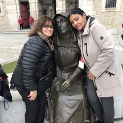 Brittany Beauty Academy Levittown - Avila,Spain My friend Tess and I taking a picture with Saint Theresa of Avila statue