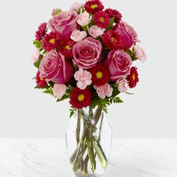 Blooms Farmer Florist - 6 pink roses, 3 pink carnations, 3 stems of aster or 6 red carnations $34.99 mention Yelp get $4.99 off.