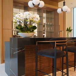 Austin Granite Direct - We used Midnight Marquina Polished 3cm Quartz for this island, creating a bold and modern centerpiece with a sleek black background.