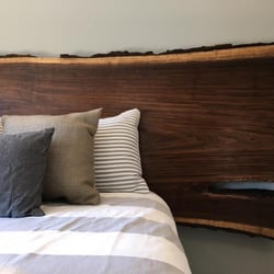 Omaha Wood Co. - Live edge black walnut king/queen headboard created and installed by American Arborist Wood Products