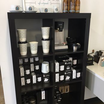 Barocco Coffee - a shelf of coffee and coffee cups - Coffee & Tea Supplies Near Me - Mississauga, Ontario