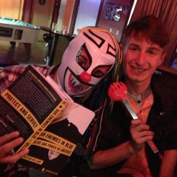 Randy's Place - a man in a clown mask holding a book and a knife - Dive Bars Near Me - San Francisco, California Randy's Place - a man in a clown mask holding a book and a knife - Dive Bars Near Me - San Francisco, California