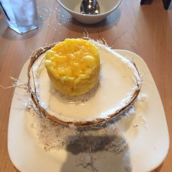 Malai Kitchen - Mango sticky rice. Cold mango on top of sweet sticky rice, in a pool of coconut milk. Shredded coconut around the base. - Vietnamese Near Me - Southlake, Texas Malai Kitchen - Mango sticky rice. Cold mango on top of sweet sticky rice, in a pool of coconut milk. Shredded coconut around the base. - Vietnamese Near Me - Southlake, Texas