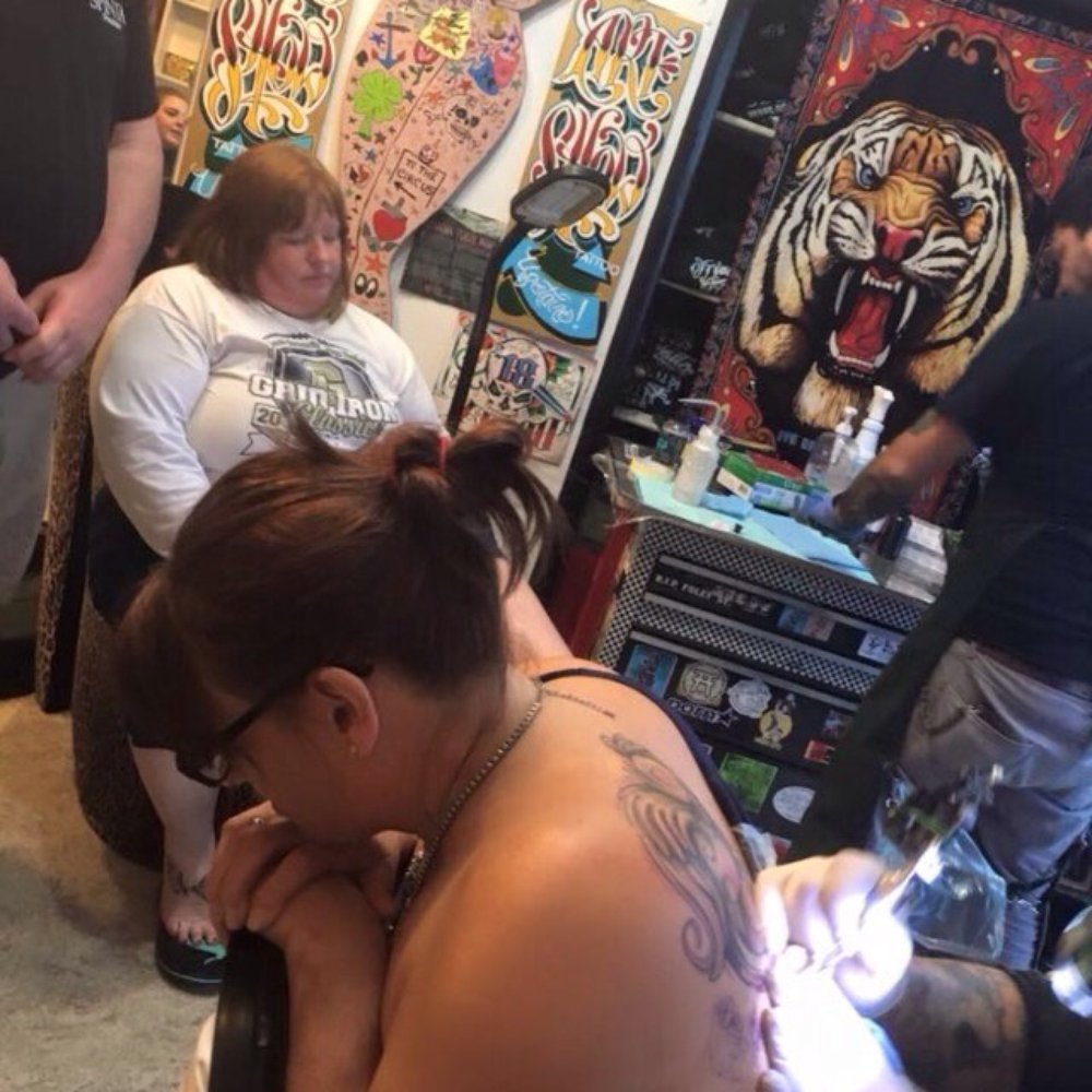 Triangle Tattoo & Museum - Susanne getting a quote added on to a previous tattoo - Tattoo Near Me - Fort Bragg, California Triangle Tattoo & Museum - Susanne getting a quote added on to a previous tattoo - Tattoo Near Me - Fort Bragg, California