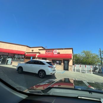 Kiki's Chicken Place - a car parked in front of the store - Chicken Wings Near Me - Sacramento, California