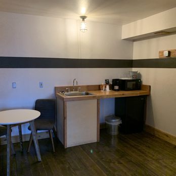Ashore Hotel - Suite Plus-Kitchenette in plus has small table and chairs. - Hotels Near Me - Seaside, Oregon