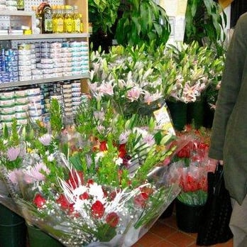 K & H Gourmet Grocery - a woman standing in front of a flower shop - Grocery Near Me - Brooklyn, New York K & H Gourmet Grocery - a woman standing in front of a flower shop - Grocery Near Me - Brooklyn, New York