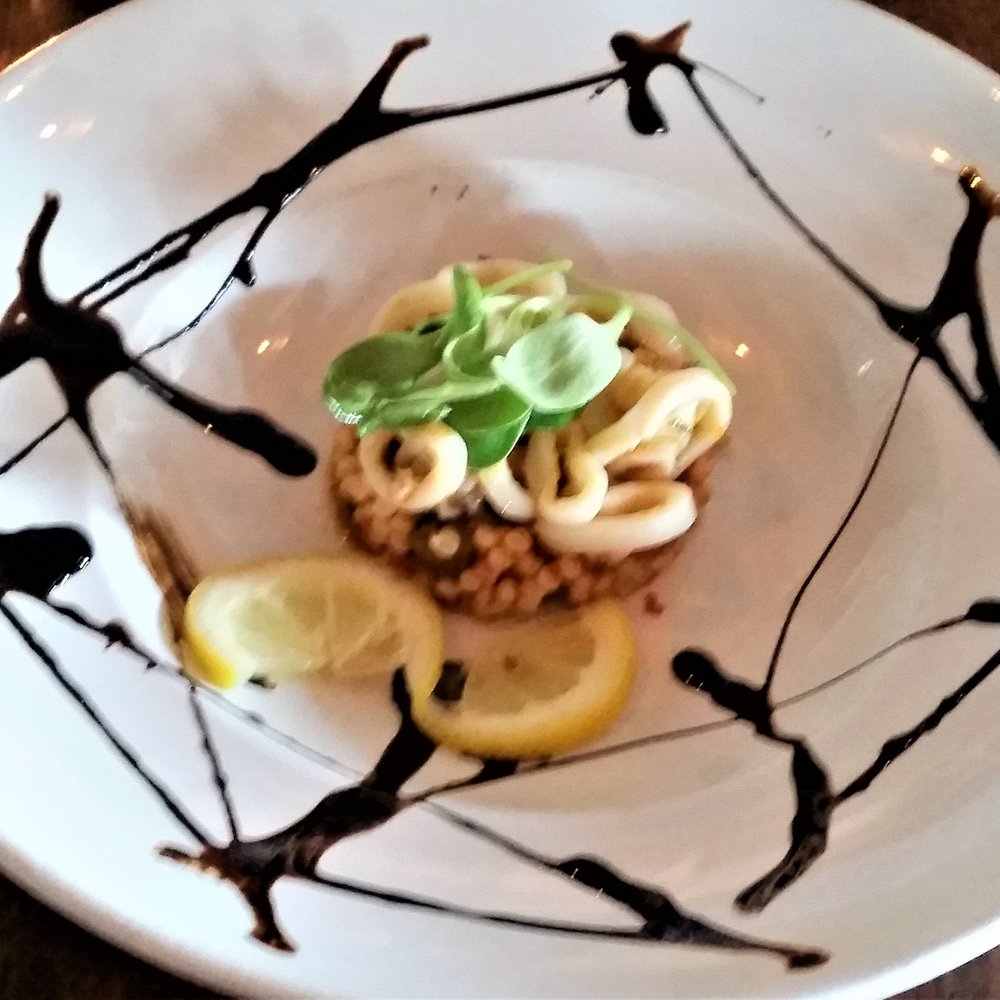 Ports Cafe - Calamari Salad w/ tomato-basil couscous. - New American Near Me - Geneva, New York Ports Cafe - Calamari Salad w/ tomato-basil couscous. - New American Near Me - Geneva, New York