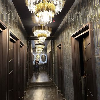 Midnight & The Wicked - a hallway with a chandelier - Lounges Near Me - Philadelphia, Pennsylvania Midnight & The Wicked - a hallway with a chandelier - Lounges Near Me - Philadelphia, Pennsylvania