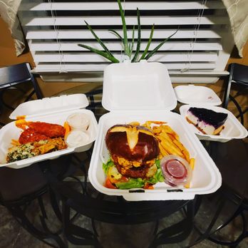 Strong Hearts Cafe - Wings, Beyond burger w/ deep fried mac & cheese patty w/ Buffalo ranch on top in a pretzel bun, and blueberry cheesecake - Sandwiches Near Me - Syracuse, New York