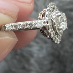 Originals by Chad - Bent Crown and obviously larger diamond that doesn't fit in the setting (top diamond on band).