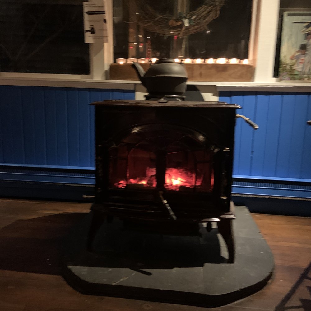 The Bellport - Wood burning stove, right next to our table - New American Near Me - Bellport, New York