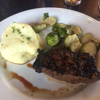 Earls Kitchen + Bar - 8 oz steak with mash potatoes and brussel sprouts - Canadian (New) Near Me - Banff, Alberta Earls Kitchen + Bar - 8 oz steak with mash potatoes and brussel sprouts - Canadian (New) Near Me - Banff, Alberta